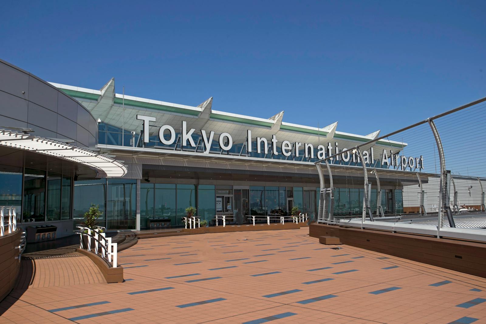 Exterior view of Tokyo Haneda International Airport terminal on a clear day