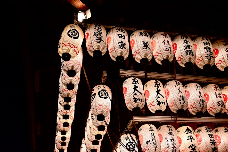 Japanese paper lanterns glowing at a Tokyo temple festival
