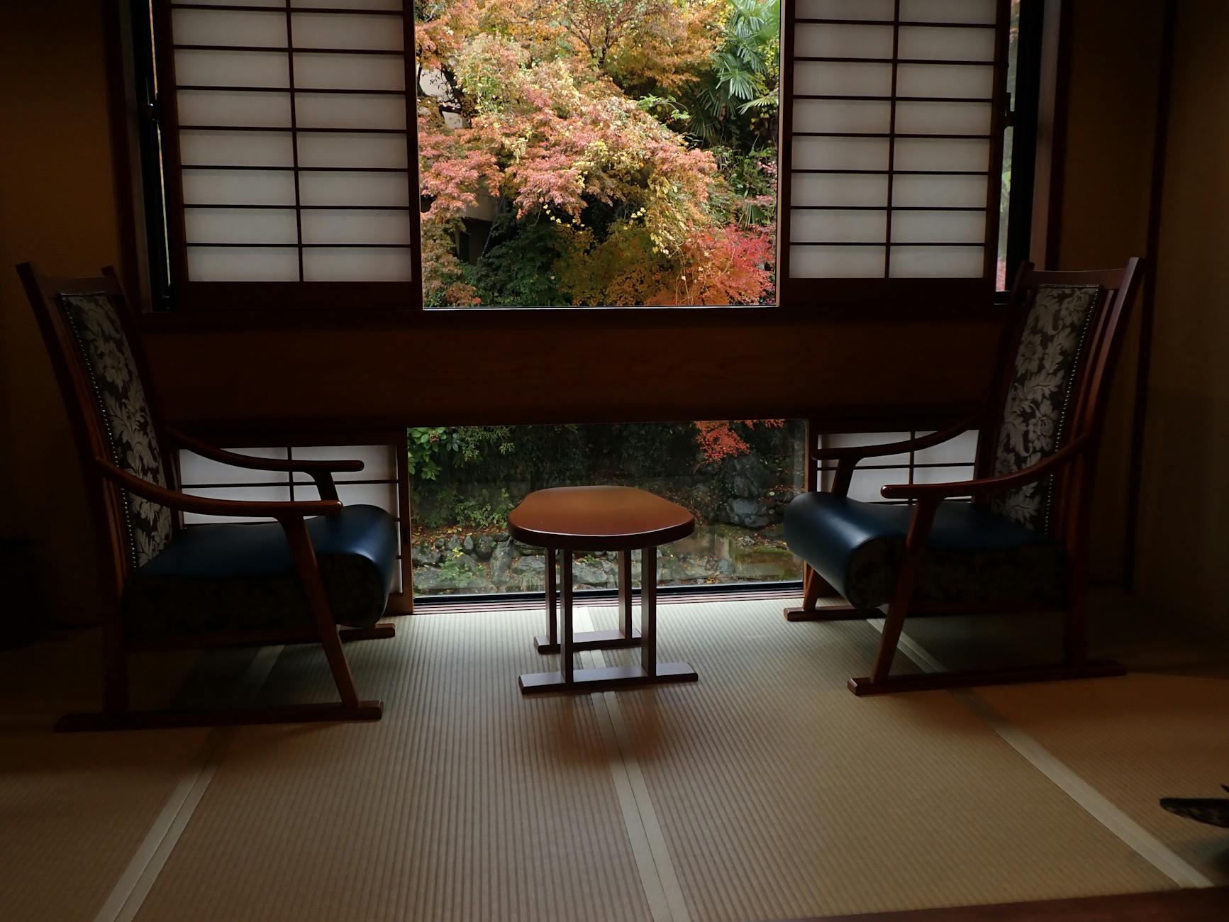 Traditional Japanese ryokan room with tatami mats and futon bedding