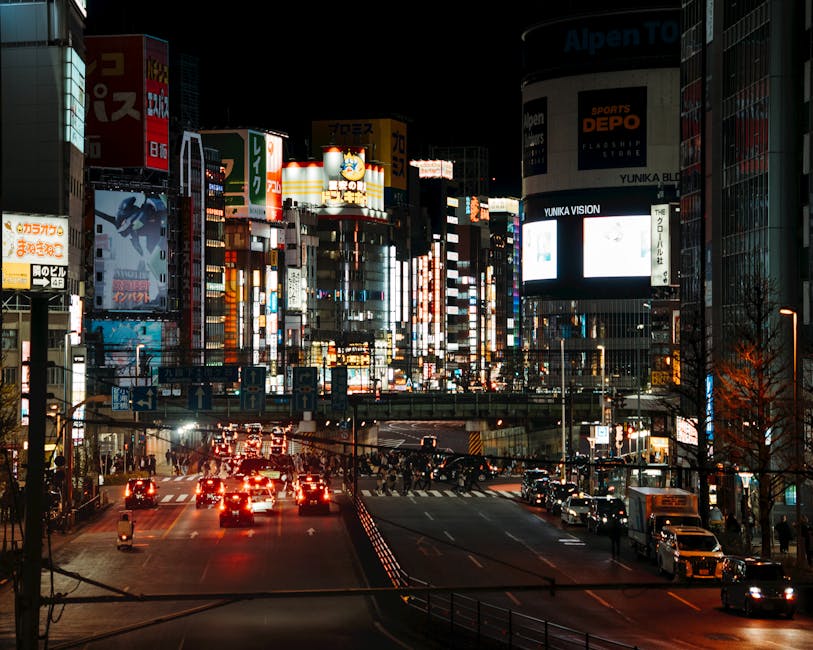 Shinjuku neon lights at night illuminating Tokyo streets