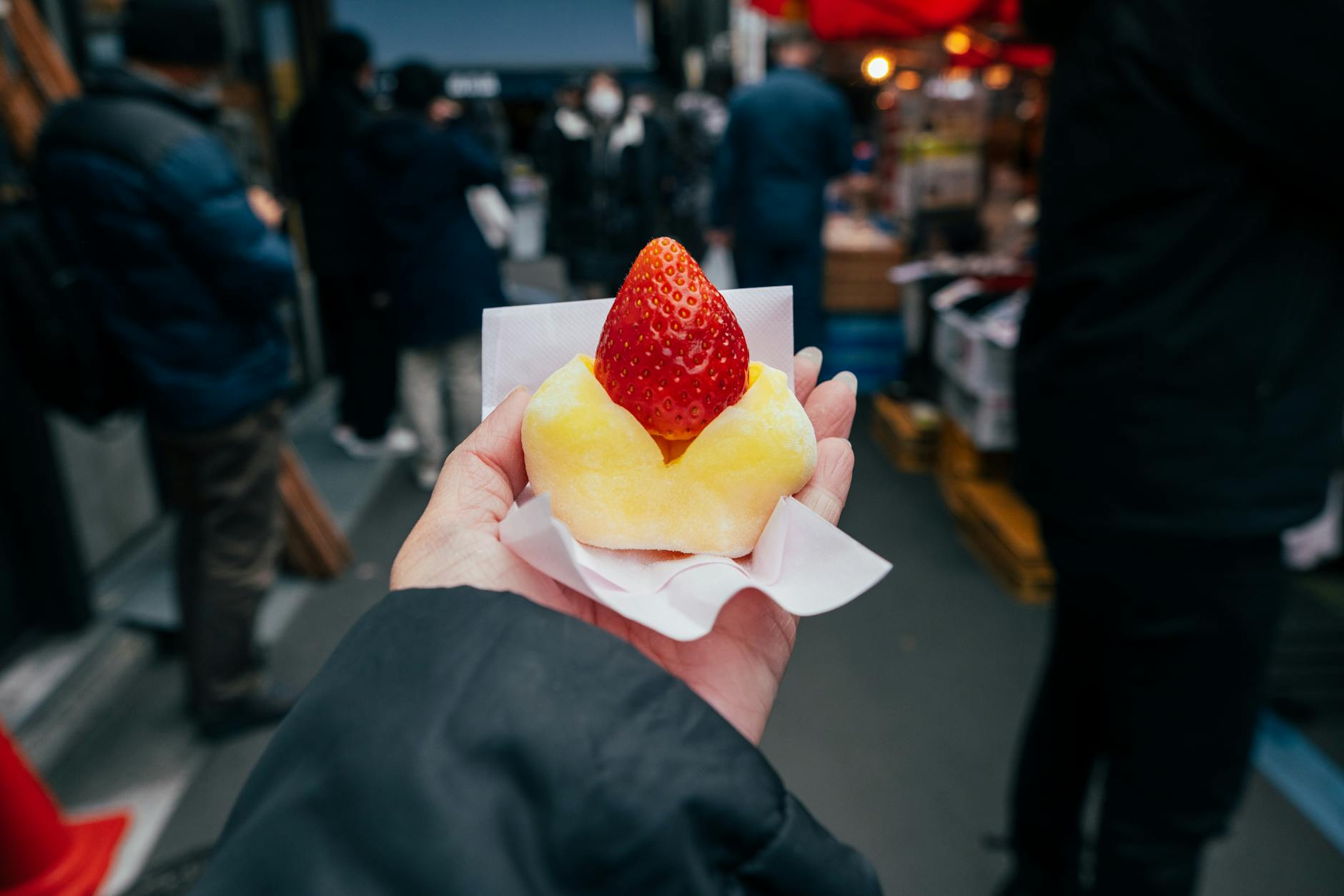 Vibrant Tokyo street food market stall with vendors serving fresh snacks