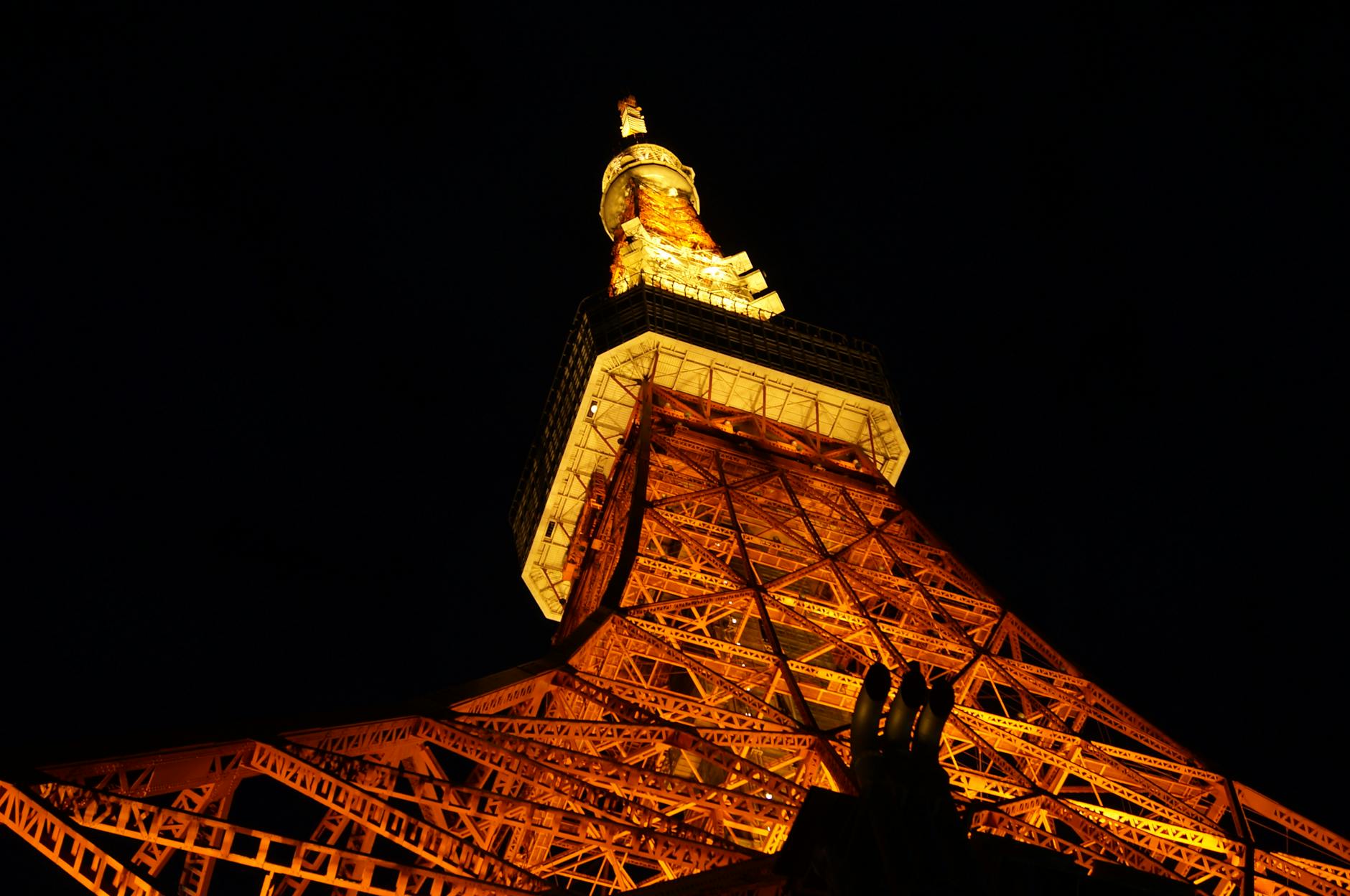 Tokyo Tower illuminated at night with city skyline