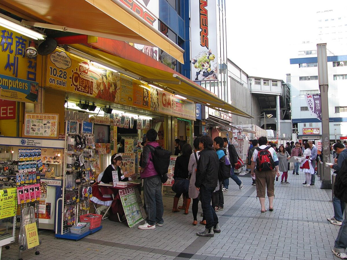 Anime billboards and shops on an Akihabara street