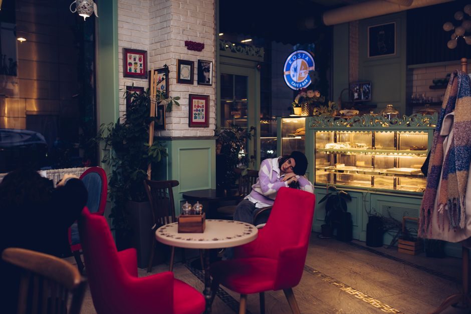 A cozy cafe interior with warm lighting