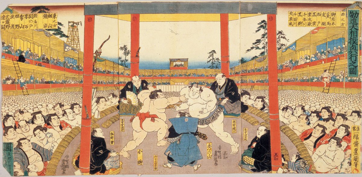 Spectators filling the arena at a grand sumo tournament in Tokyo