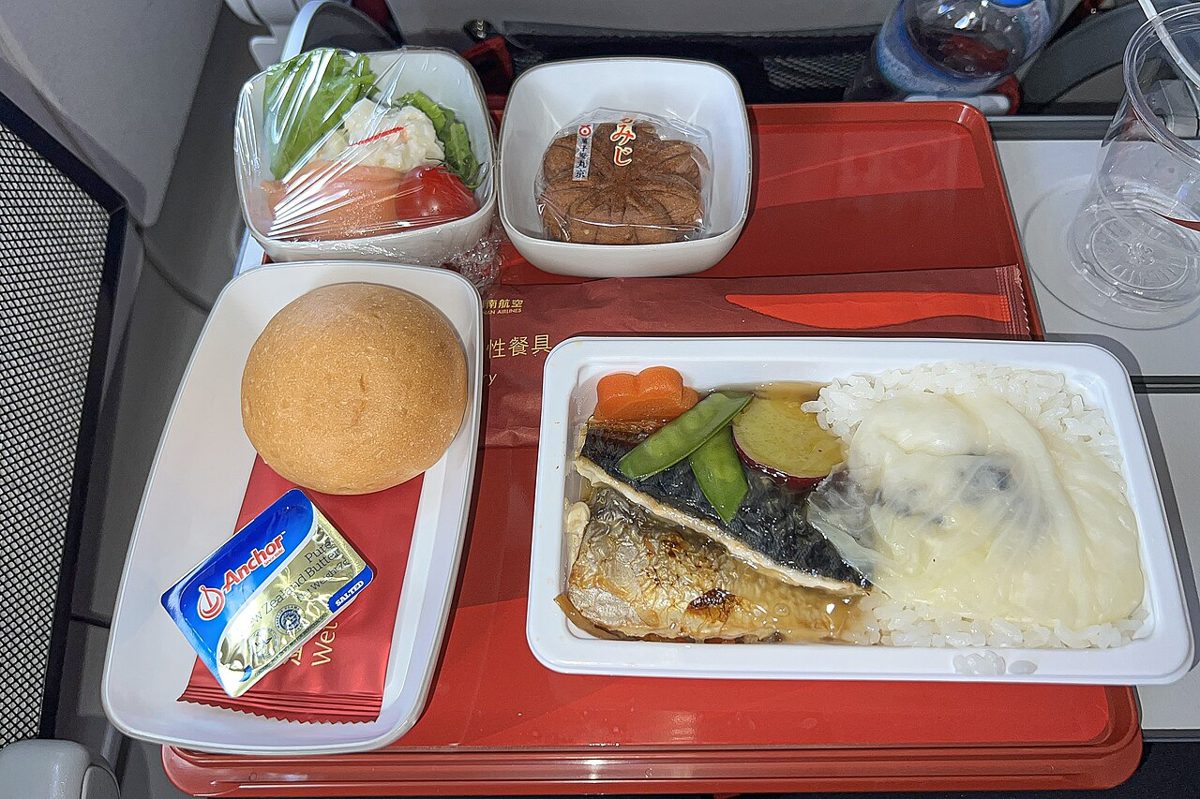 A grilled salted mackerel fillet served as part of a Japanese breakfast set