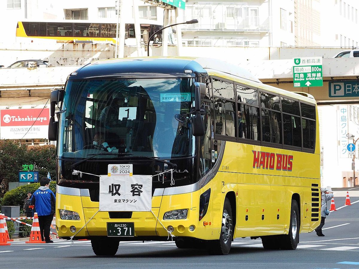 A yellow Hato Bus sightseeing coach in Tokyo