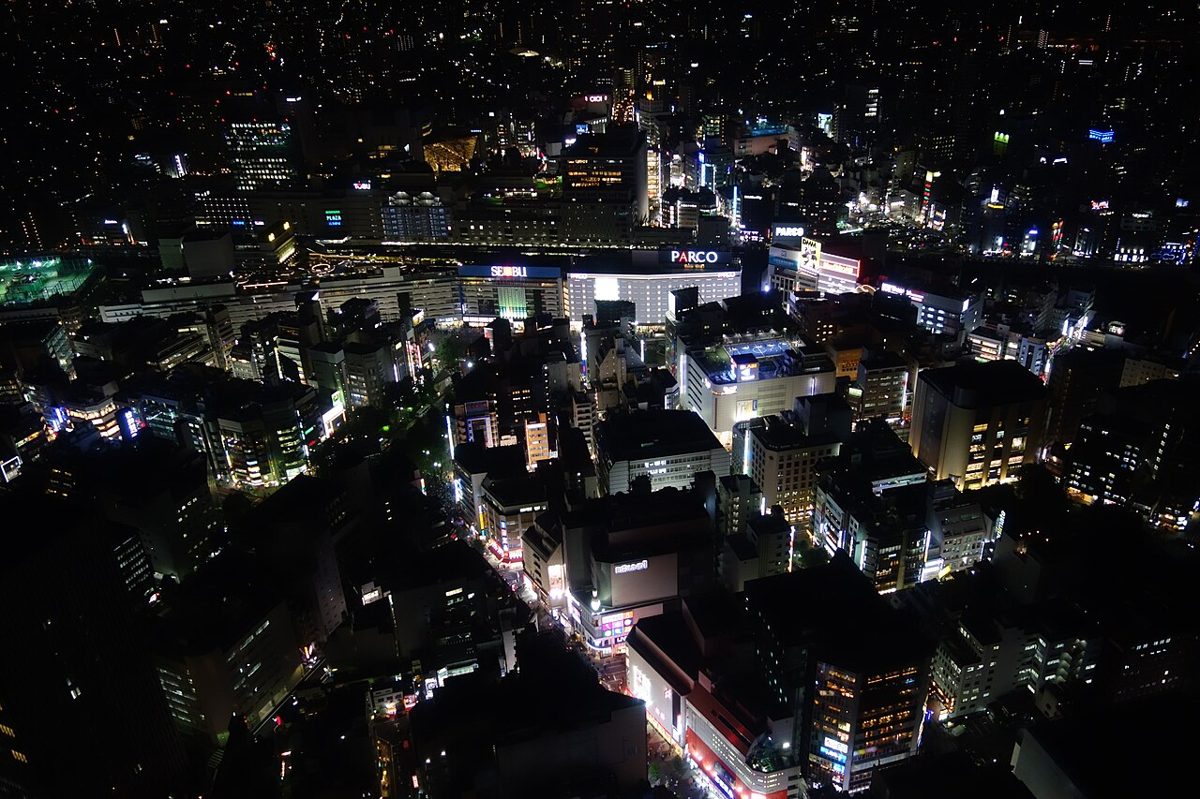 Neon-lit streets of Ikebukuro at night in Tokyo