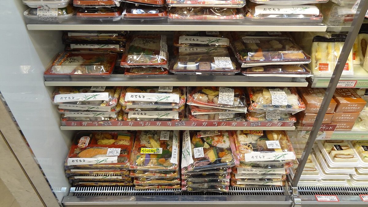 Inside a Japanese convenience store with shelves of goods