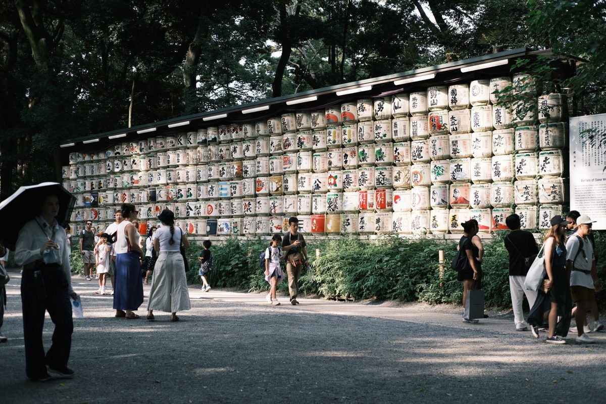 Colorful stacked sake barrels donated to Meiji Jingu
