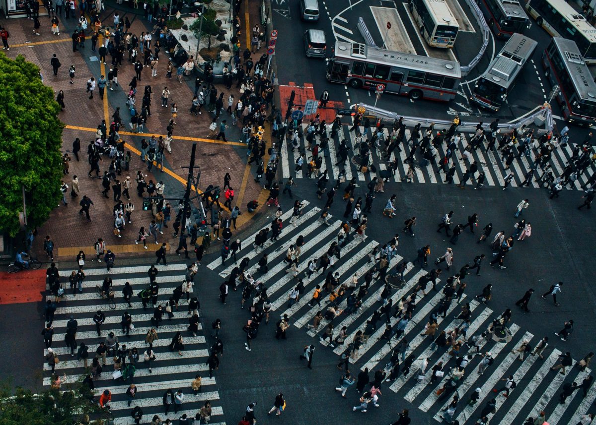 An elevated view looking down on the diagonal Shibuya Scramble Crossing