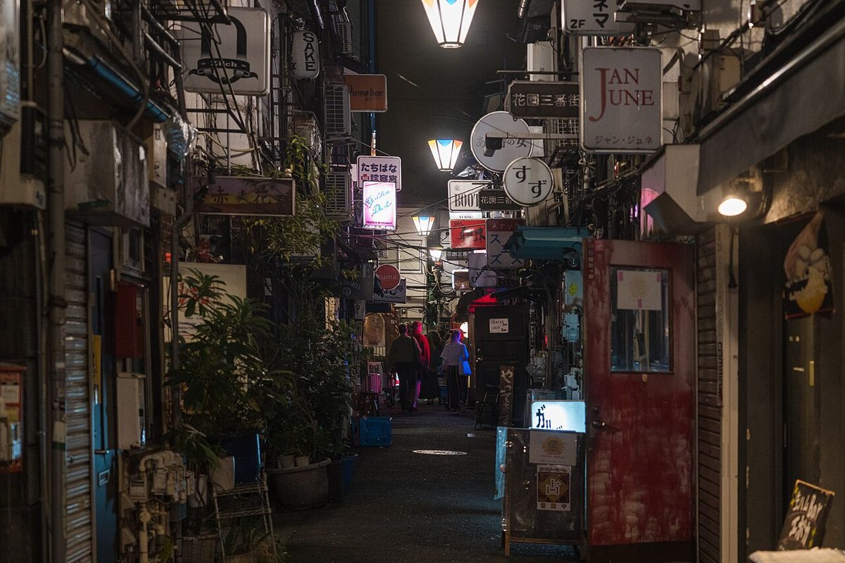 Narrow lantern-lit alley of tiny bars in Golden Gai, Shinjuku