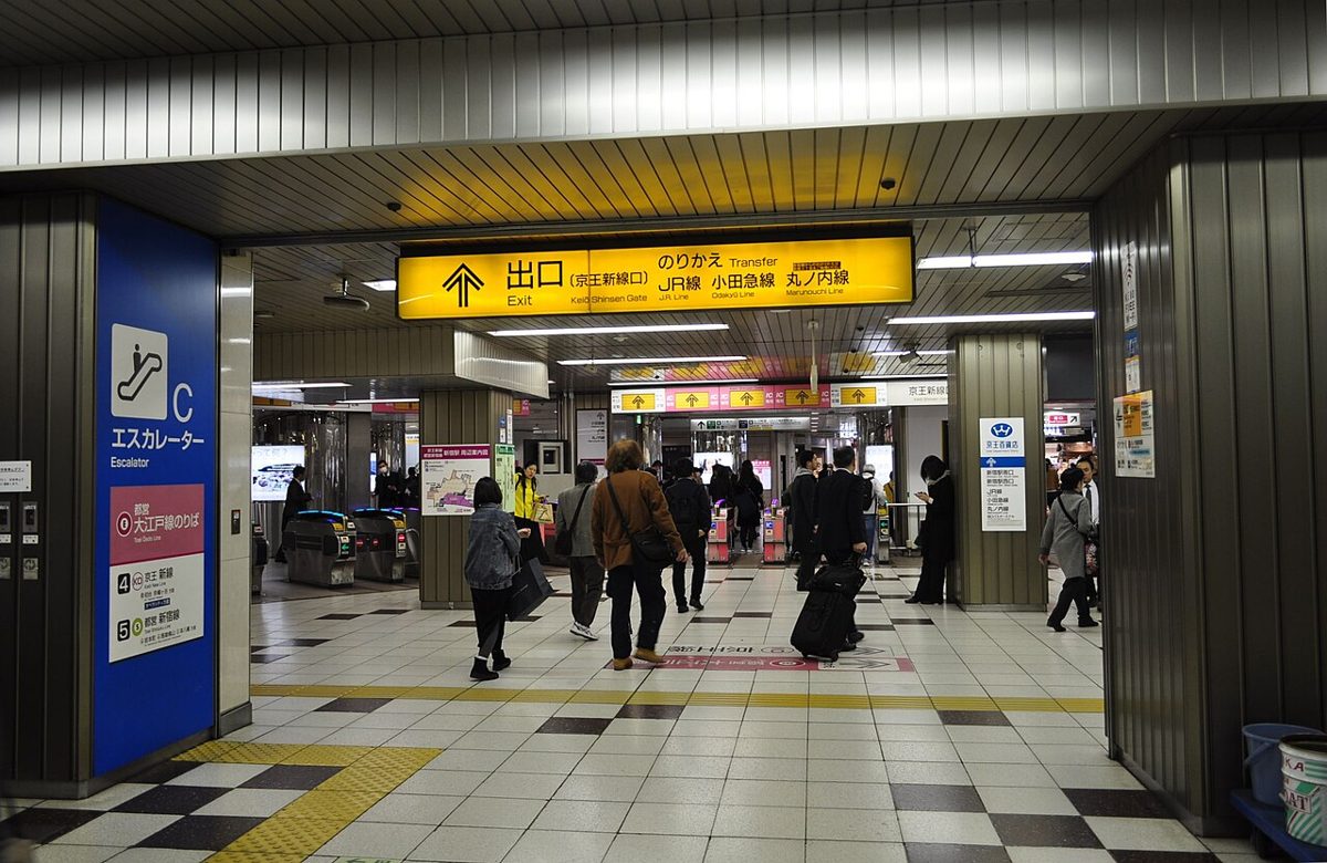The busy interior concourse of Shinjuku Station in Tokyo