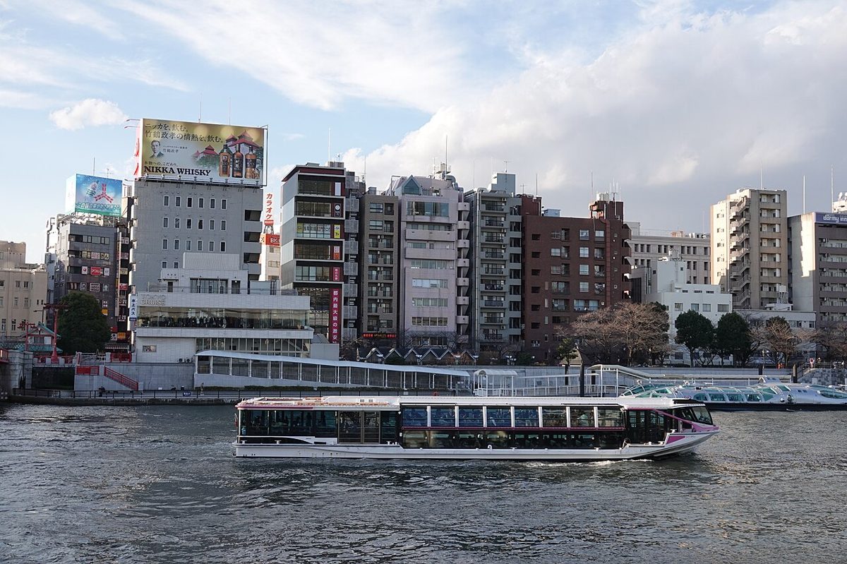 Sumida River with Tokyo Skytree and a passing boat