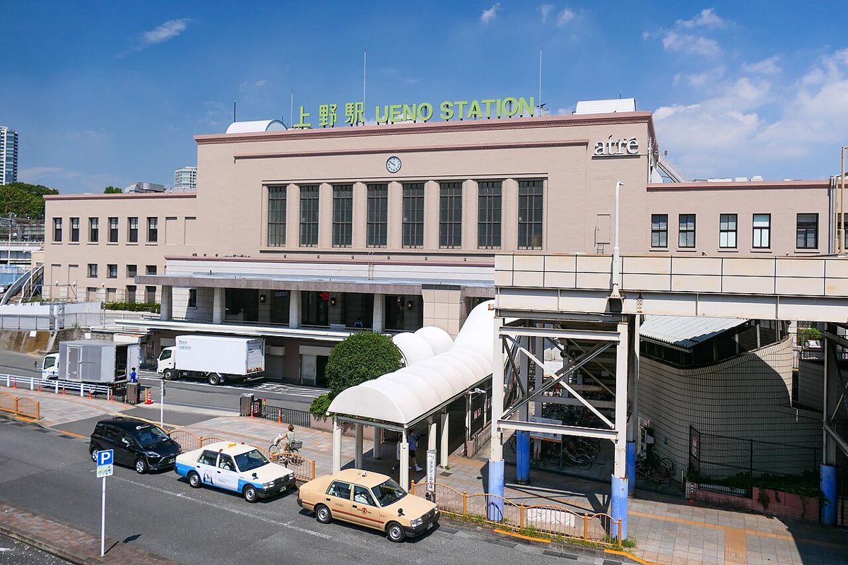 Exterior of a Taito Station game center with the Space Invader logo in Tokyo