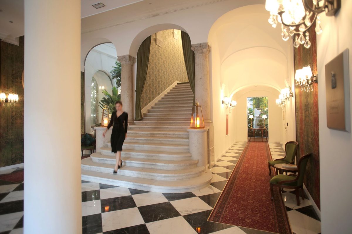 An ornate hotel lobby with Italian-style architecture