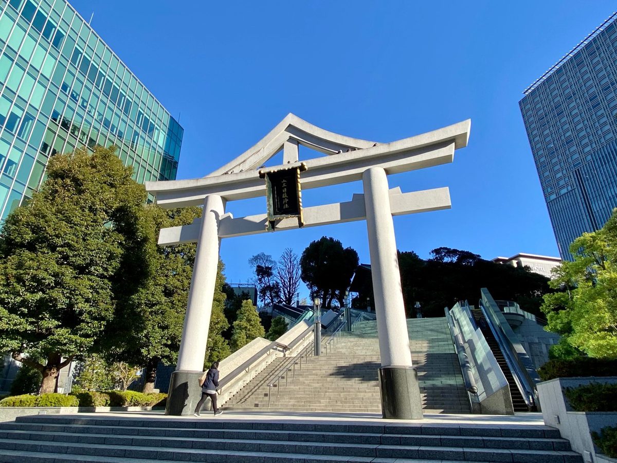 Vermilion torii gates climbing the stone steps at Hie Shrine in Akasaka