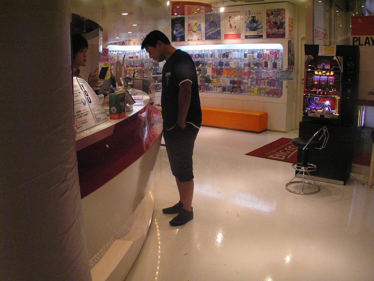 Friends singing in a private karaoke box in Tokyo