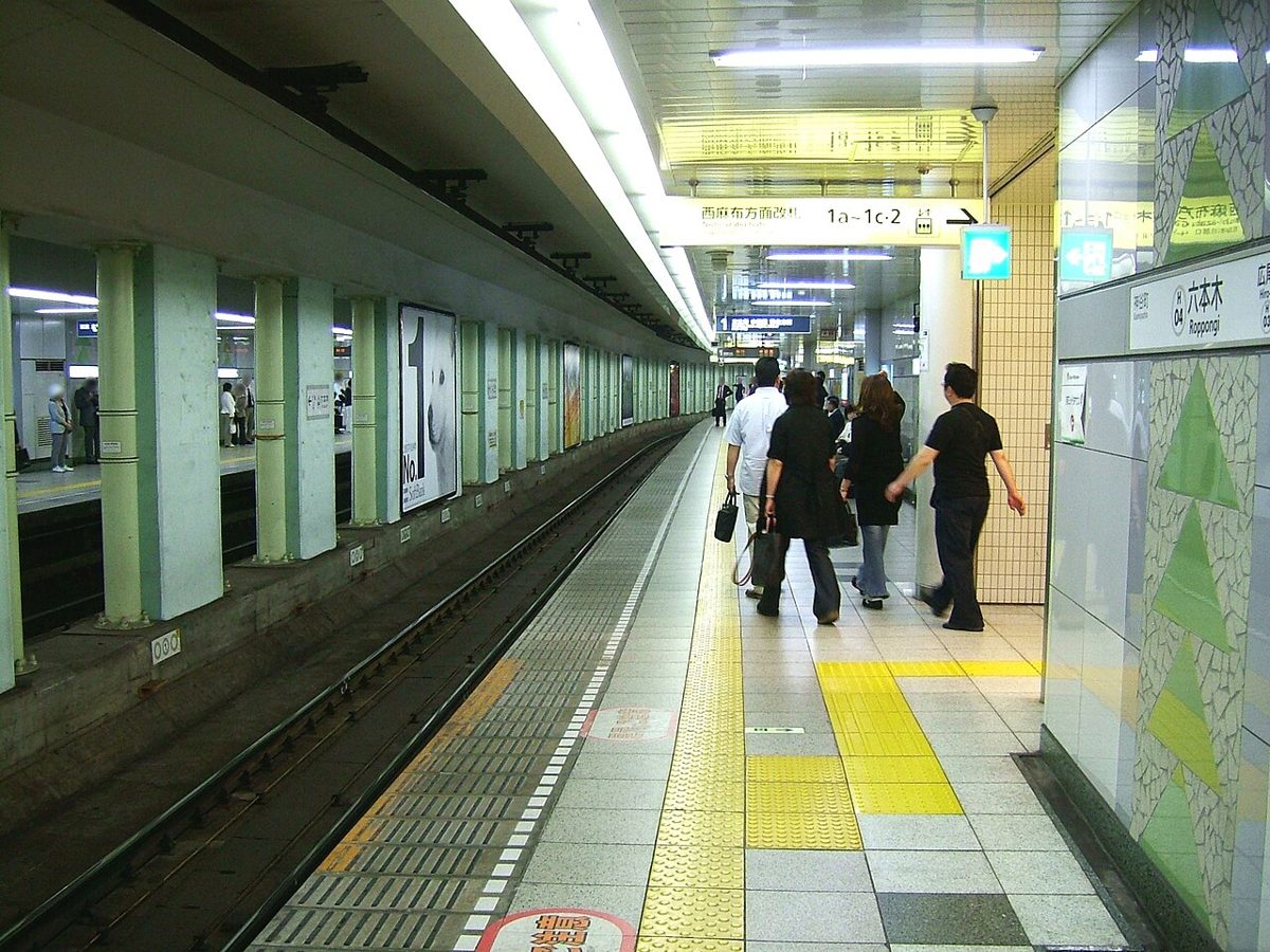 A Tokyo Metro station platform with safety doors and signage