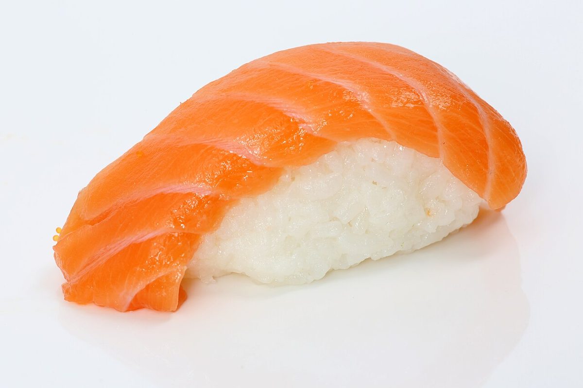 Assortment of fresh nigiri sushi on a wooden board