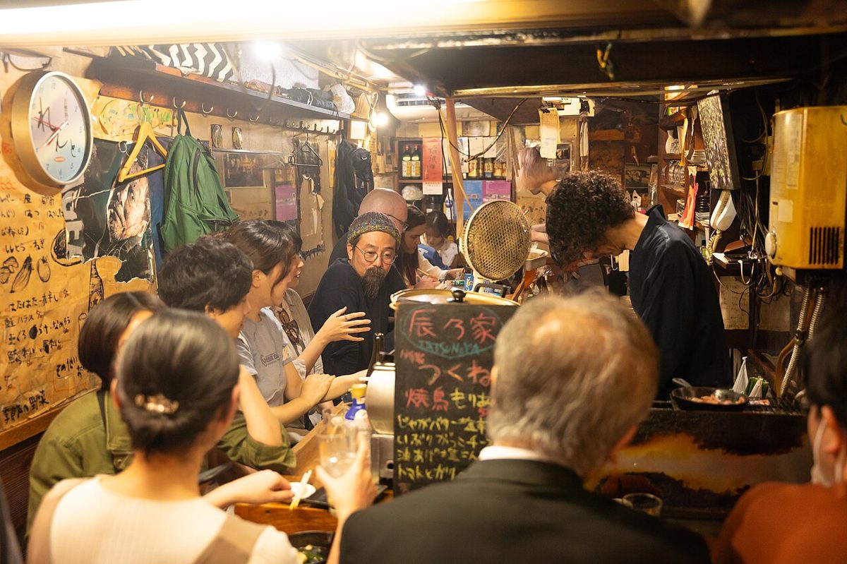 The narrow lantern-lit alley of Omoide Yokocho in Shinjuku