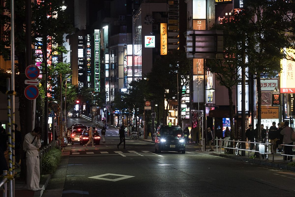 Neon-lit Shinjuku street at night in Tokyo