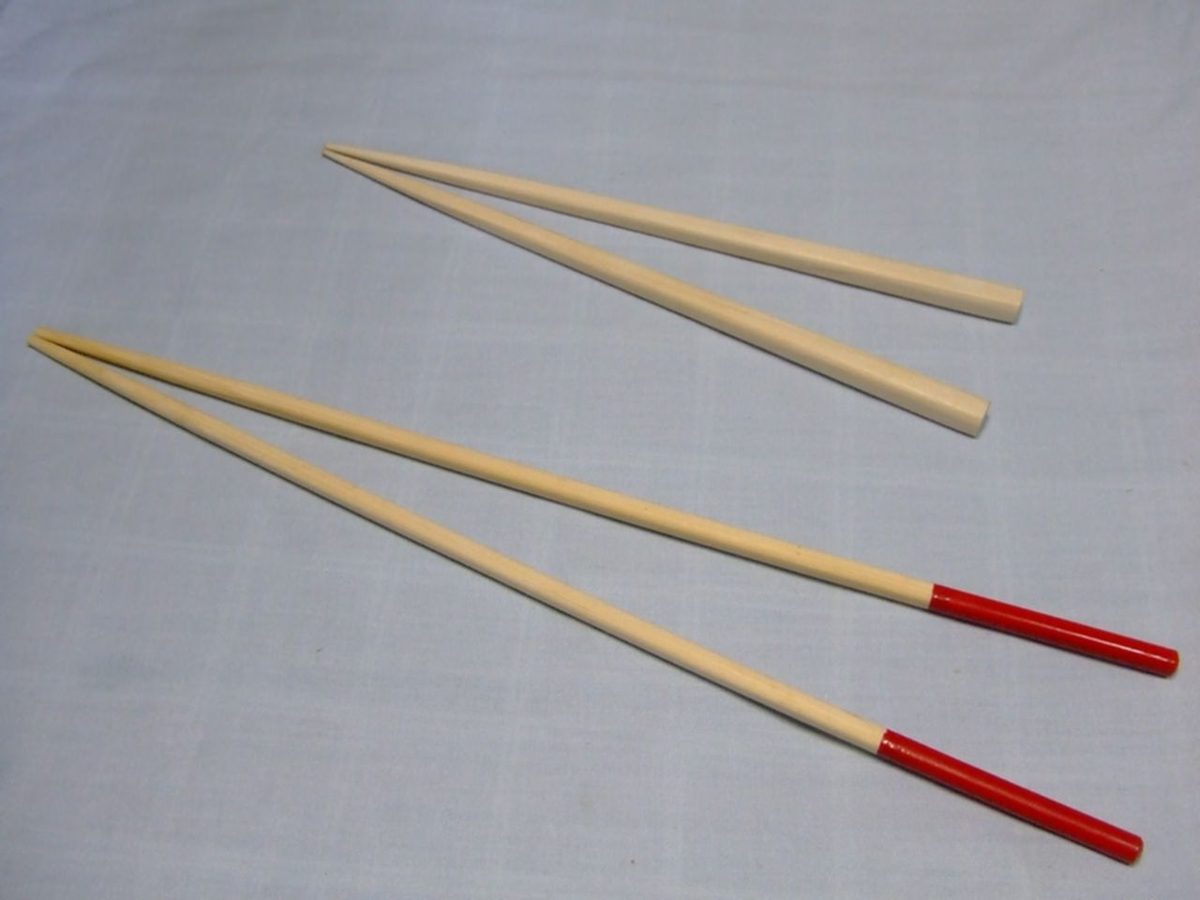 Pairs of wooden Japanese chopsticks with red lacquered handles, a classic Tokyo souvenir