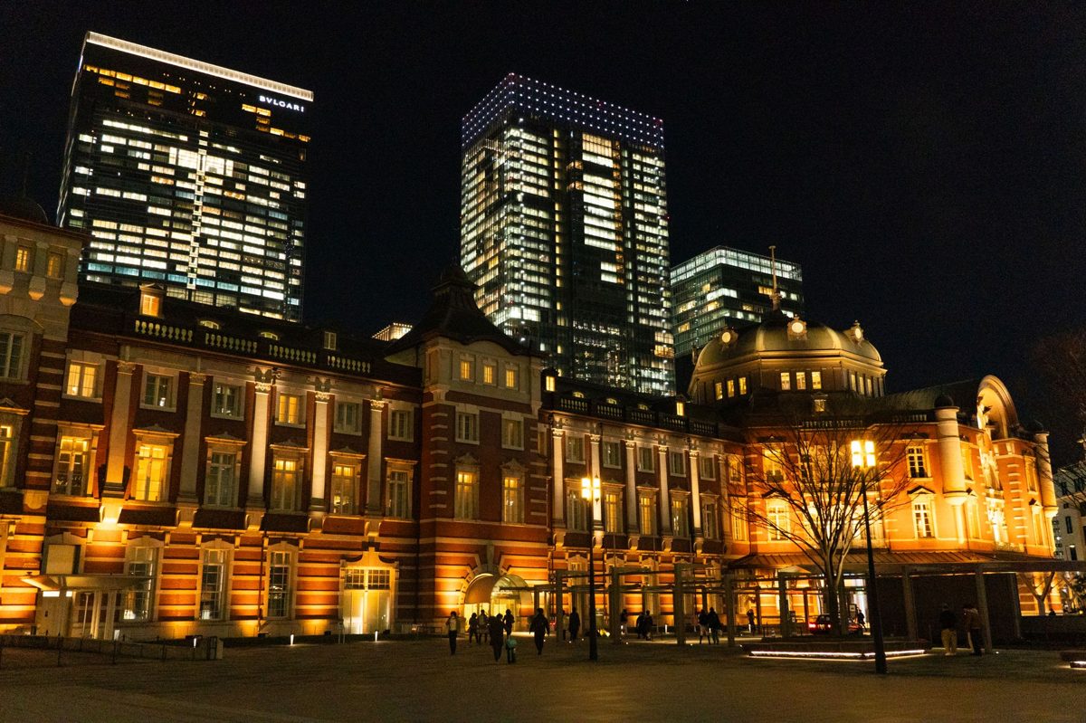 The red-brick Marunouchi facade of Tokyo Station lit at night