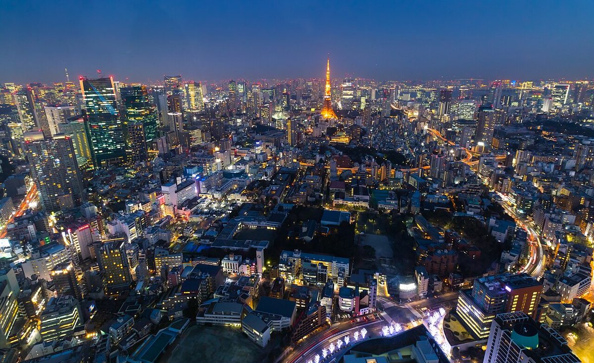 Tokyo Tower glowing orange at night, a classic rooftop-bar sightline