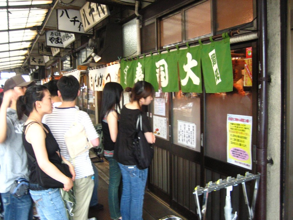 Fresh sushi and sashimi at a counter near Tsukiji