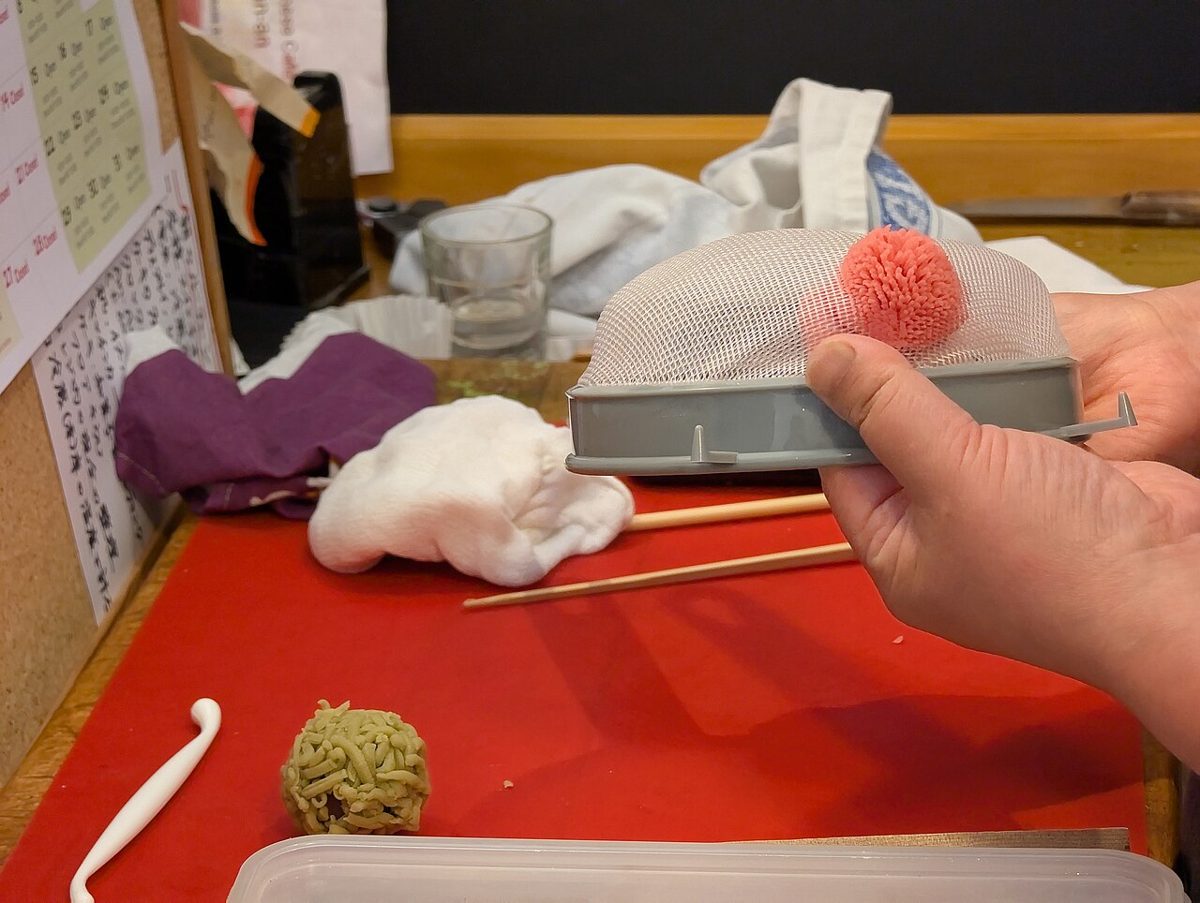 Colourful nerikiri wagashi sweets being shaped by hand