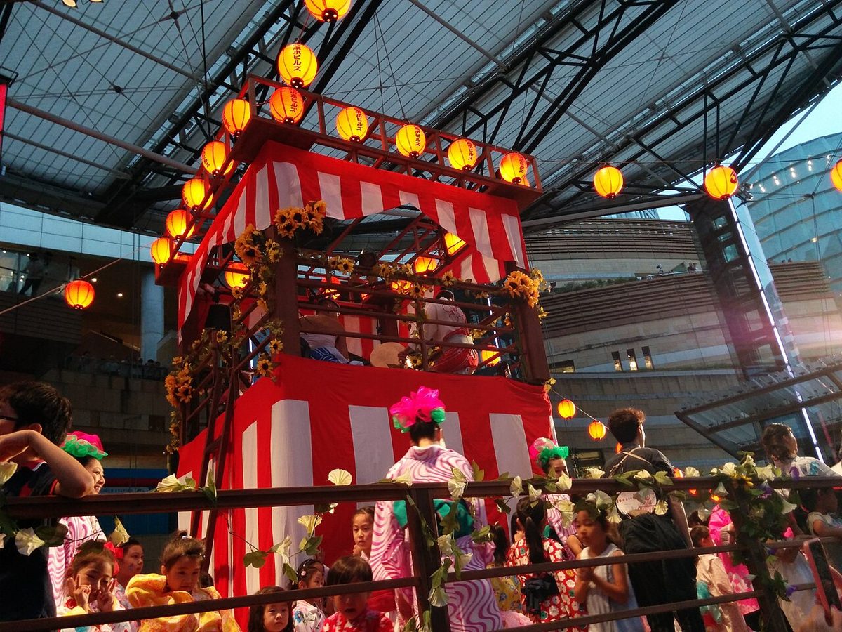 Two people wearing cotton yukata at a Japanese summer festival