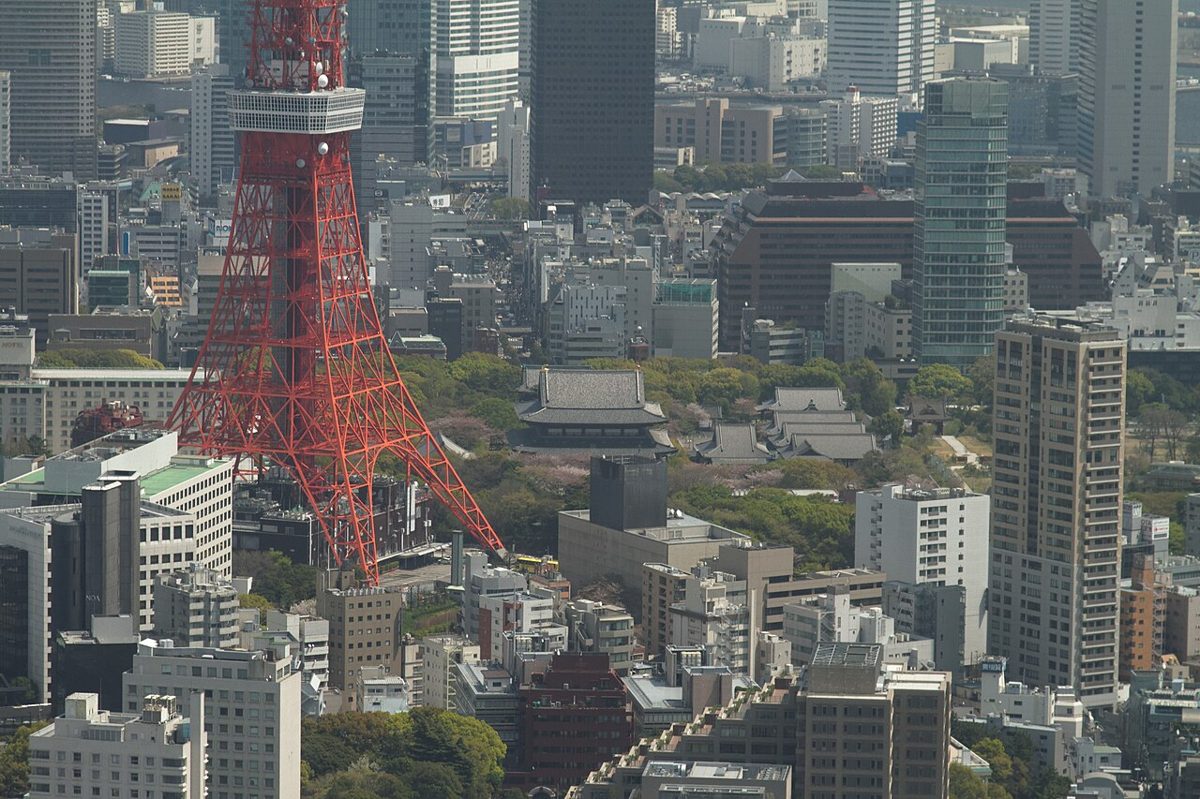 Zojoji temple with the illuminated Tokyo Tower rising behind it