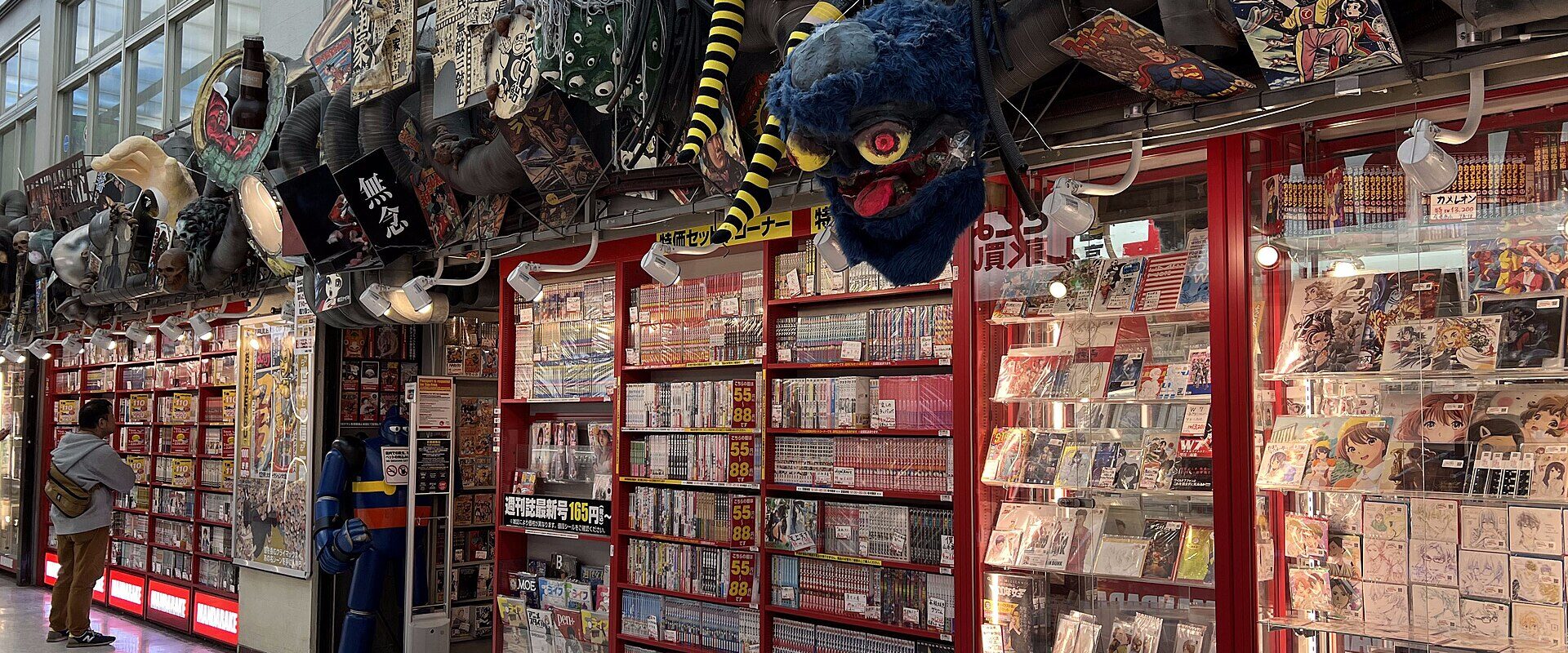 The Mandarake main store shopfront inside Nakano Broadway, hung with masks and vintage toys